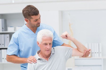 one person helps another in exercise