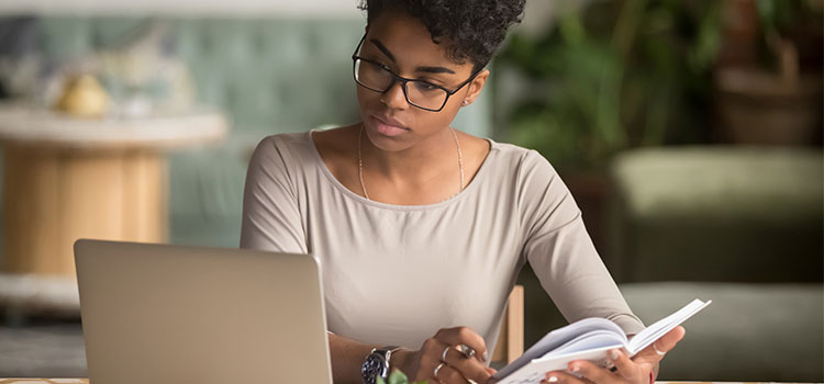 woman studying requirements for professional certification exam