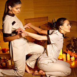 women doing breema bodywork