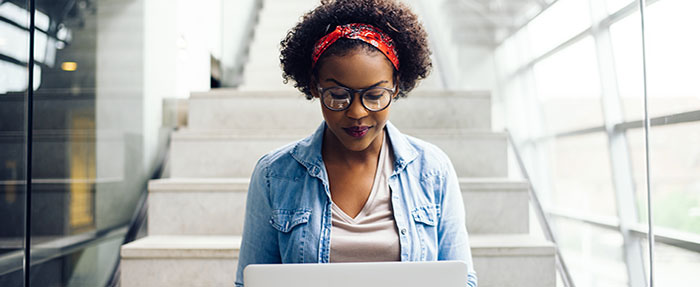 woman looking at laptop