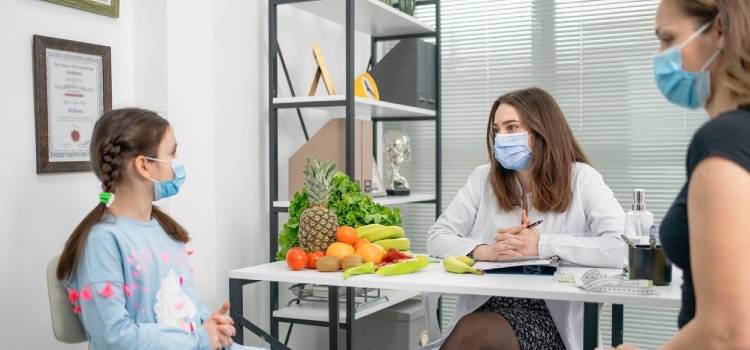 smiling-female-extending-a-small-salad-bowl