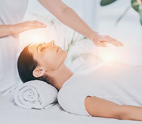 polarity therapy session with hands over patient