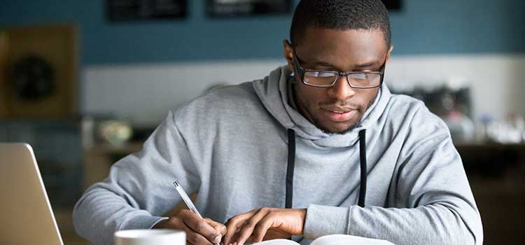 male student filling out application