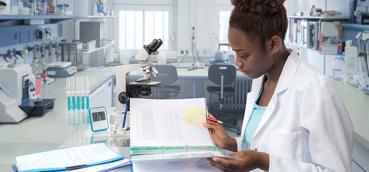 woman in lab researching programs