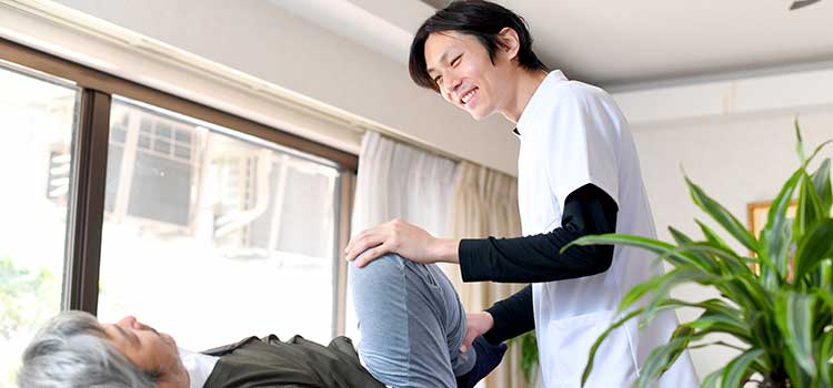 practitioner working on patient knee