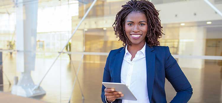 woman applying for license on tablet in modern agency