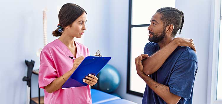 chiropractor in texas confers with client about his back and spine issues